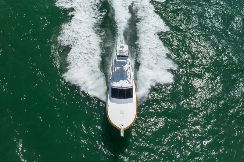 Slide: The Image of 2015 Jarrett Bay Hardtop Express Sportfish cruising on open water, aerial view. - 92