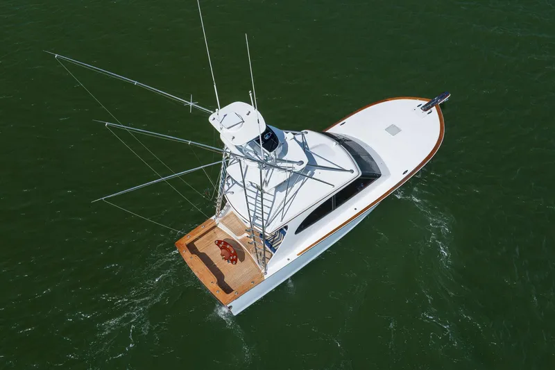 Slide: The Image of 2015 Jarrett Bay Hardtop Express Sportfish cruising on open water, aerial view. - 93