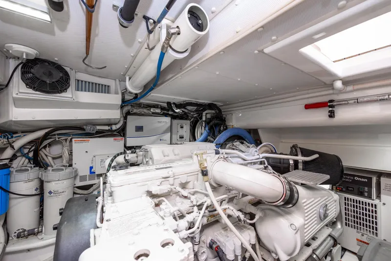 Slide: The Image of Engine room of 2015 Jarrett Bay Hardtop Express Sportfish, showcasing mechanical components and systems. - 96