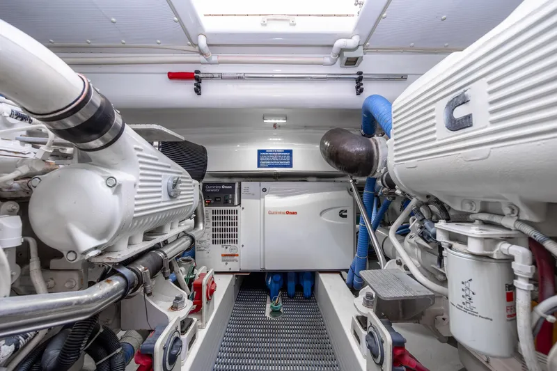 Slide: The Image of Engine room of 2015 Jarrett Bay Hardtop Express Sportfish with Cummins Onan generator. - 97