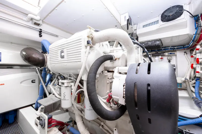 Slide: The Image of Engine room of 2015 Jarrett Bay Hardtop Express Sportfish, showcasing mechanical components. - 99