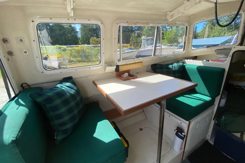 Slide: The Image of Interior of a 1999 C-Dory 22' Angler boat with equipment and supplies. - 5