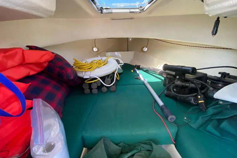 Slide: The Image of 1999 C-Dory 22' Angler boat with fishing station, docked in a marina. - 8