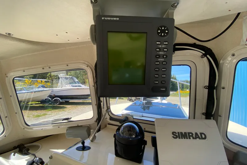 Slide: The Image of 1999 C-Dory 22' Angler boat interior with ropes, fenders, and equipment. - 9
