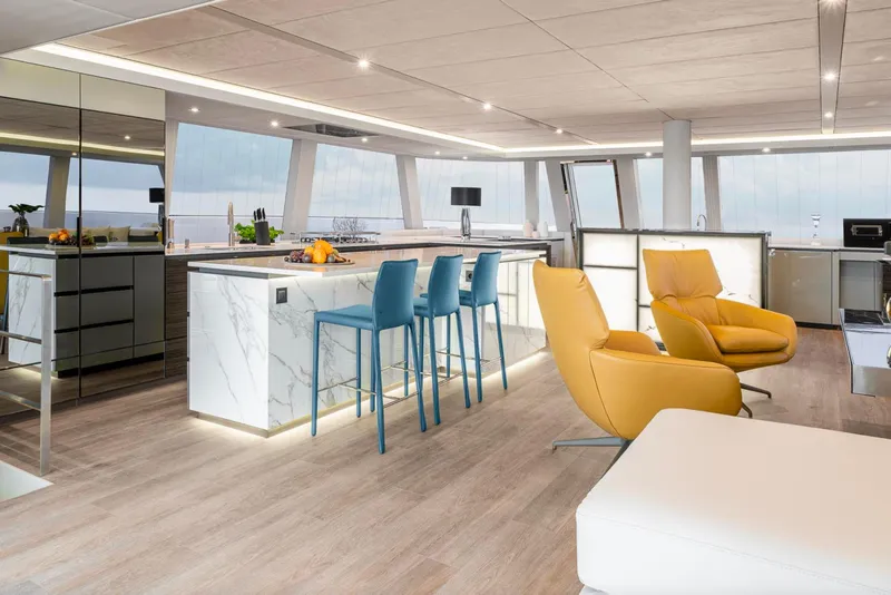 Slide: The Image of Luxurious interior of 2022 Sunreef 80 Sail yacht with modern kitchen and seating area. - 4