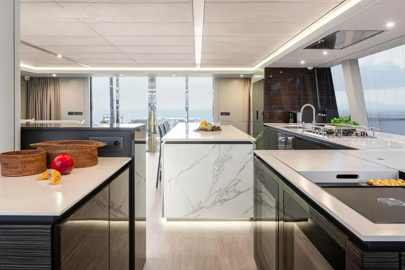 Slide: The Image of Luxurious interior of 2022 Sunreef 80 Sail yacht with modern kitchen design. - 7