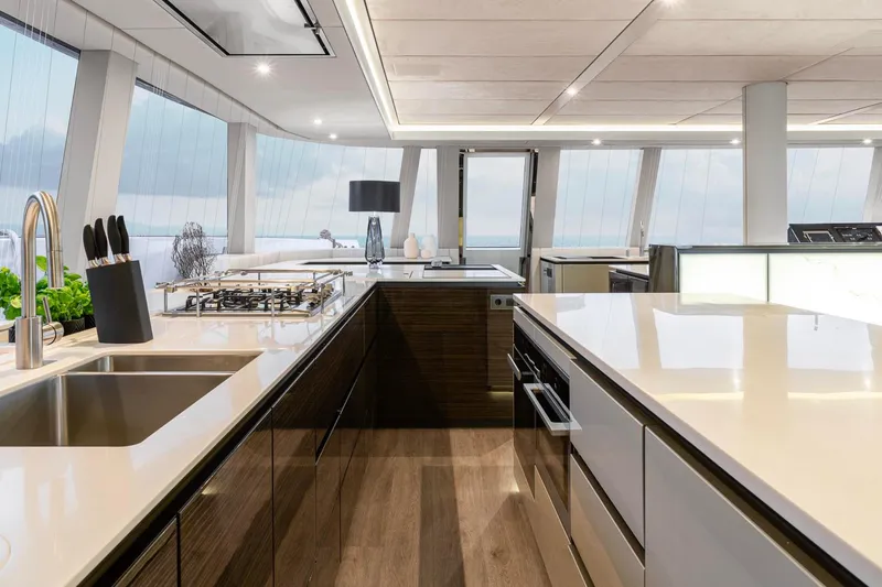 Slide: The Image of Luxurious kitchen interior of 2022 Sunreef 80 Sail yacht with modern design and ocean view. - 8