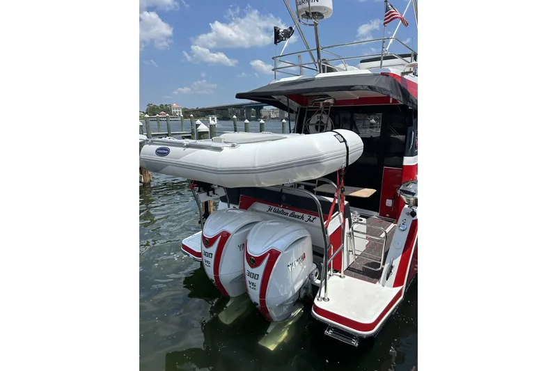 Slide: The Image of 2024 Jeanneau NC Weekender 1095 Fly with Yamaha engines and inflatable boat, docked. - 6