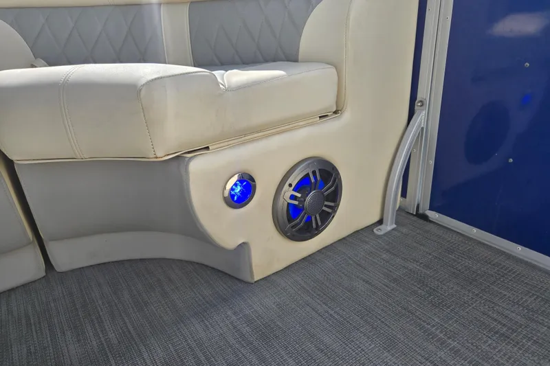 Slide: The Image of Luxurious Lexington 320 boat interior with plush seating and illuminated speaker, 2022 model. - 21