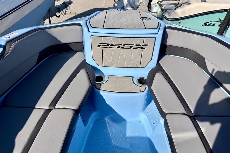 Slide: The Image of 2025 Yamaha Boats 255XD interior detail with sleek dashboard and modern design elements. - 12