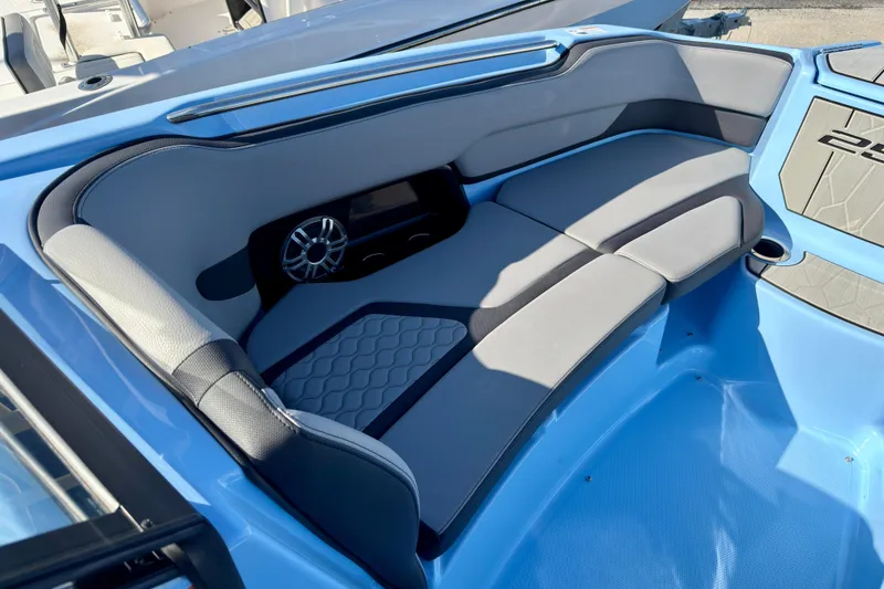 Slide: The Image of Interior of 2025 Yamaha Boats 255XD, featuring sleek gray seating and modern speaker system. - 17