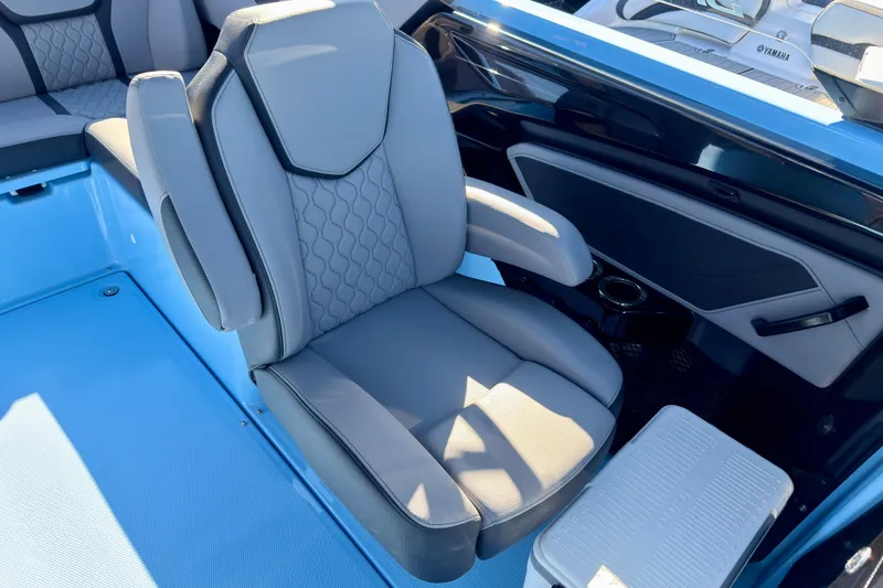 Slide: The Image of 2025 Yamaha Boats 255XD interior seating with modern design and integrated speaker system. - 18
