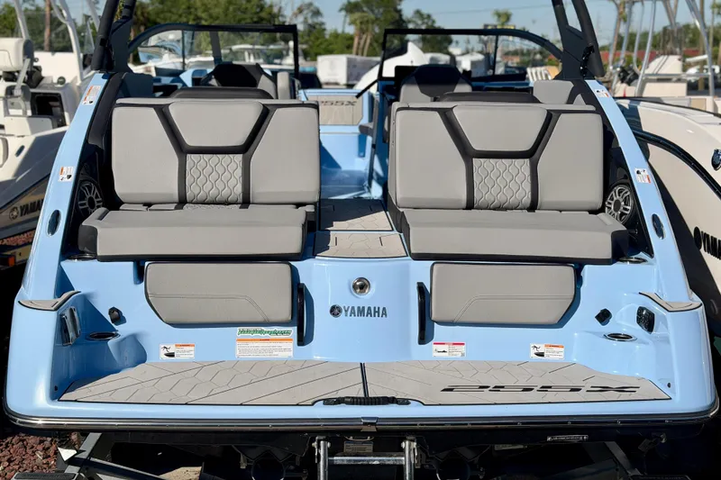 Slide: The Image of 2025 Yamaha Boats 255XD with sleek seating and modern design. - 33