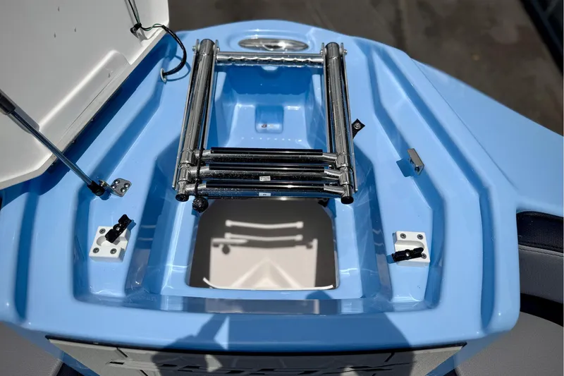 Slide: The Image of 2025 Yamaha Boats 255XD ladder compartment with open hatch, showcasing sleek design. - 8
