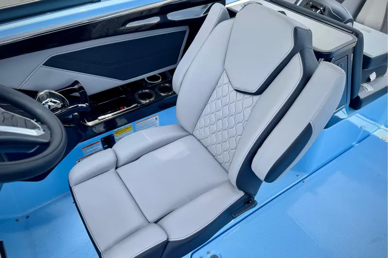 Slide: The Image of 2025 Yamaha Boats 255XD interior seat with modern design and blue accents. - 9