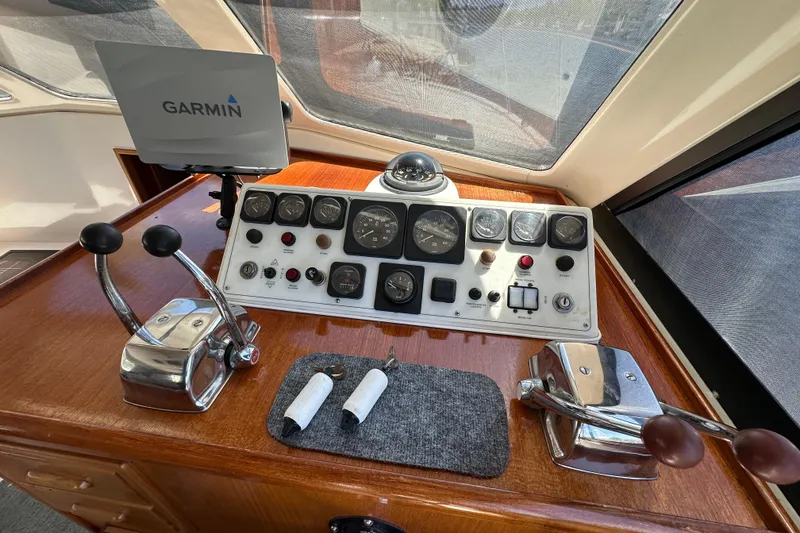 Slide: The Image of Control panel of a 1999 Riviera 3600 Sport Yacht with Garmin navigation system. - 9