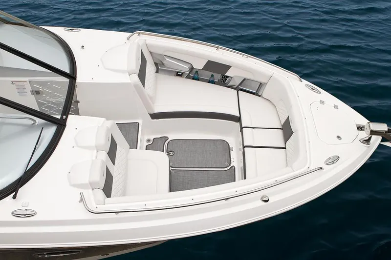 Slide: The Image of Manufacturer Provided Image: 2014 Chaparral 327 SSX boat bow seating area on calm water. - 11
