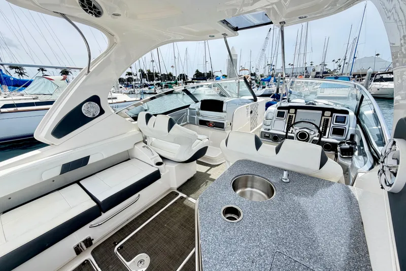 Slide: The Image of Interior of a 2014 Chaparral 327 SSX boat with luxurious seating and modern dashboard. - 16