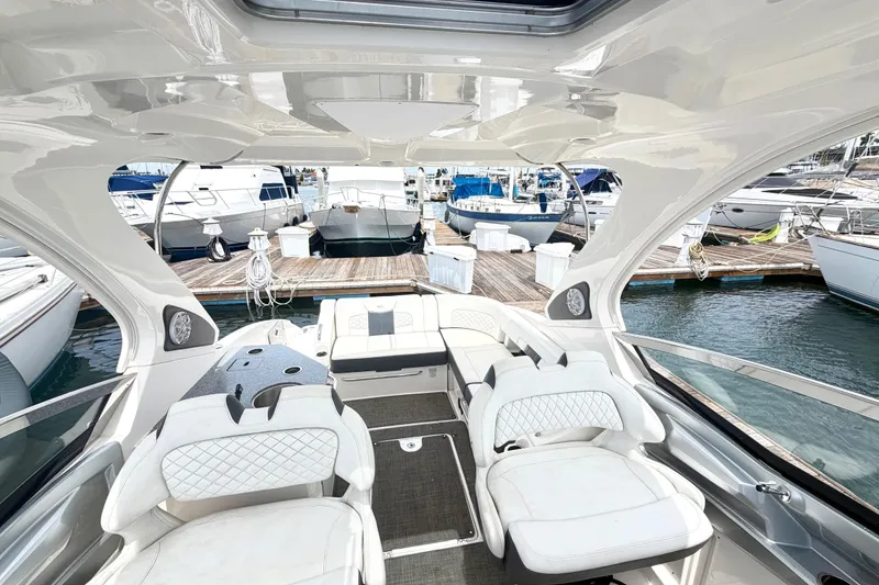 Slide: The Image of Interior view of a 2014 Chaparral 327 SSX boat docked at a marina. - 19