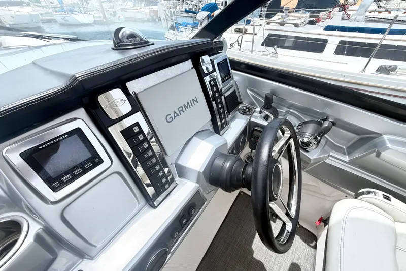 Slide: The Image of Cockpit of 2014 Chaparral 327 SSX with Garmin navigation and Volvo Penta controls. - 20