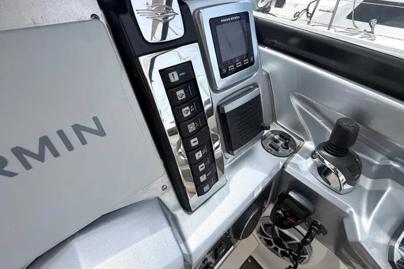 Slide: The Image of Control panel of 2014 Chaparral 327 SSX boat with Garmin and Volvo Penta systems. - 24