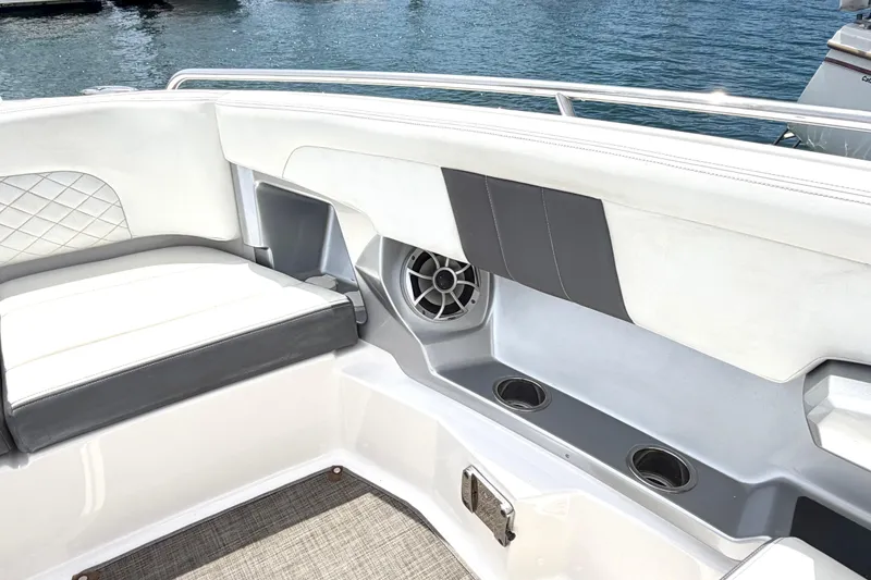Slide: The Image of Interior of 2014 Chaparral 327 SSX boat with cushioned seating and cup holders. - 38