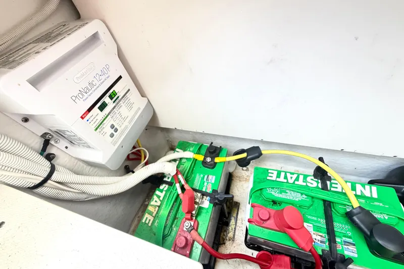Slide: The Image of Battery compartment of 2014 Chaparral 327 SSX with ProNautic 1240P charger and Interstate batteries. - 40