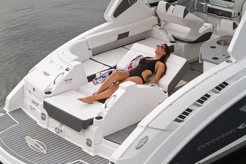 Slide: The Image of Manufacturer Provided Image: 2014 Chaparral 327 SSX boat with woman sunbathing on rear lounge seats. - 8