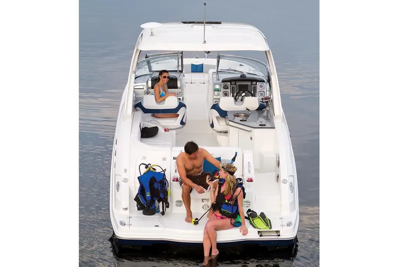 Slide: The Image of Manufacturer Provided Image: 2014 Chaparral 327 SSX boat with people enjoying water activities. - 9