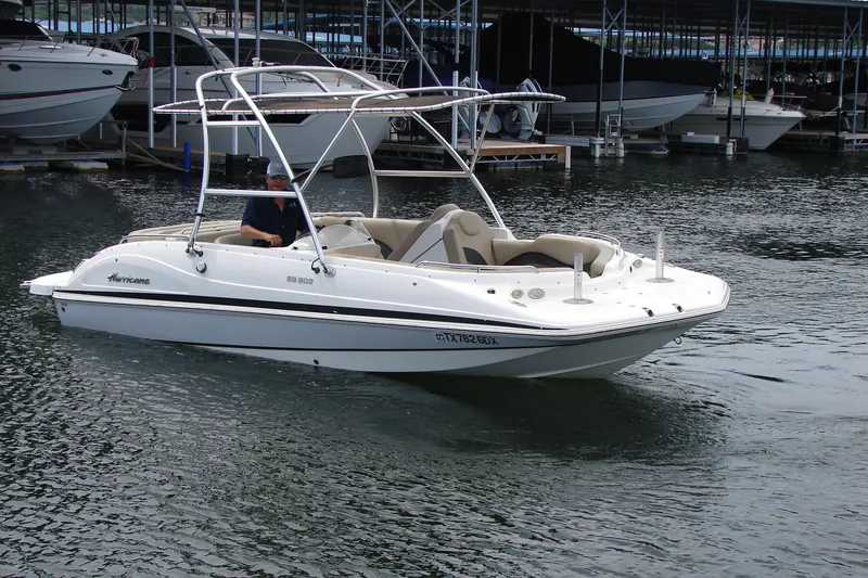 The Image of 2017 Hurricane SunDeck Sport 202 IO boat on water near marina. - 0