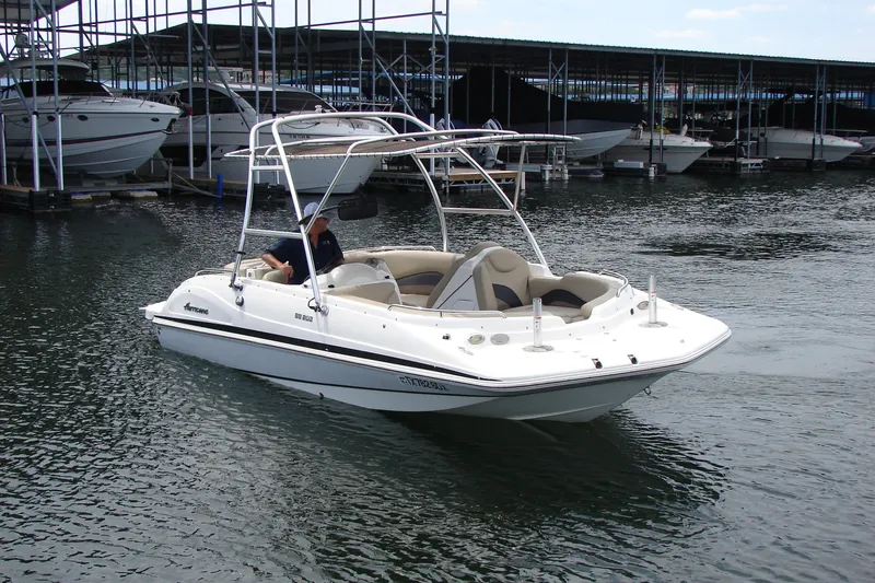 Slide: The Image of 2017 Hurricane SunDeck Sport 202 IO boat docked in marina. - 11