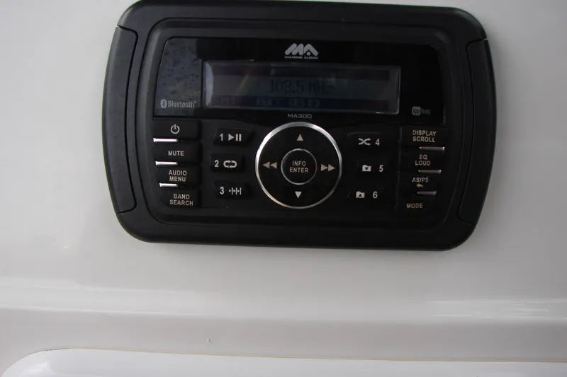 Slide: The Image of Marine audio system on 2017 Hurricane SunDeck Sport 202 IO boat dashboard. - 13