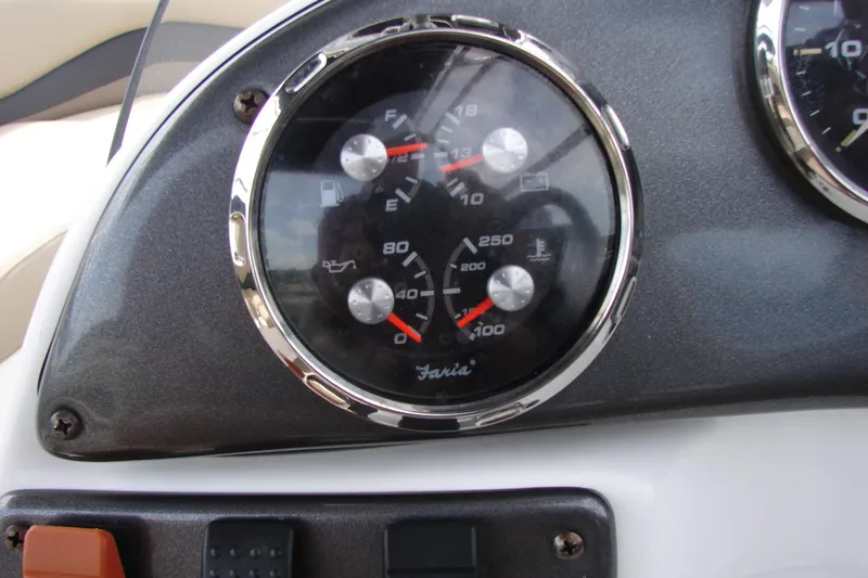 Slide: The Image of Dashboard gauges of a 2017 Hurricane SunDeck Sport 202 IO boat. - 14