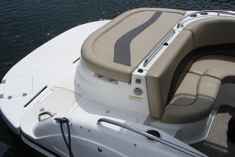 Slide: The Image of 2017 Hurricane SunDeck Sport 202 IO boat interior with beige seating and cup holders. - 19