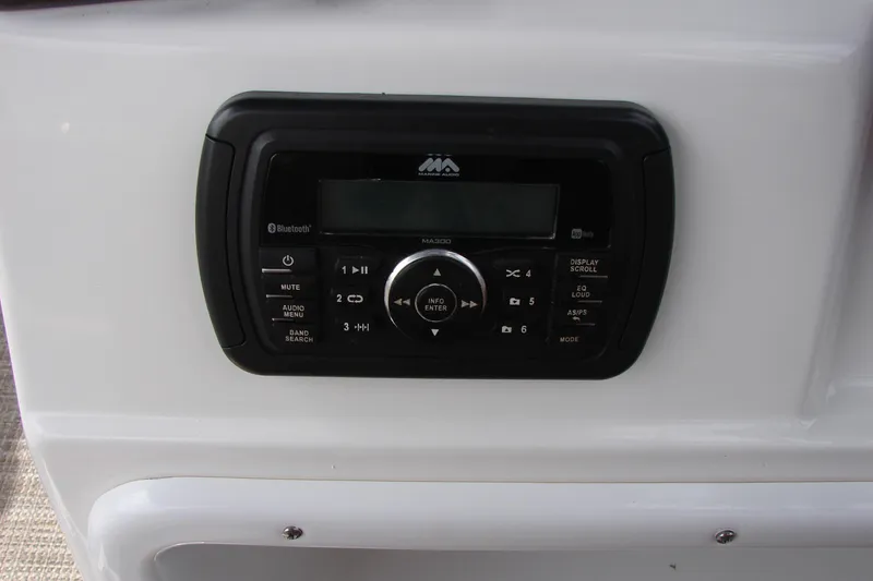 Slide: The Image of Boat stereo system on a 2017 Hurricane SunDeck Sport 202 IO with Bluetooth connectivity. - 26