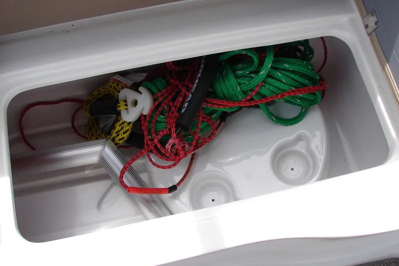 Slide: The Image of Storage compartment in 2017 Hurricane SunDeck Sport 202 IO with ropes and accessories. - 27