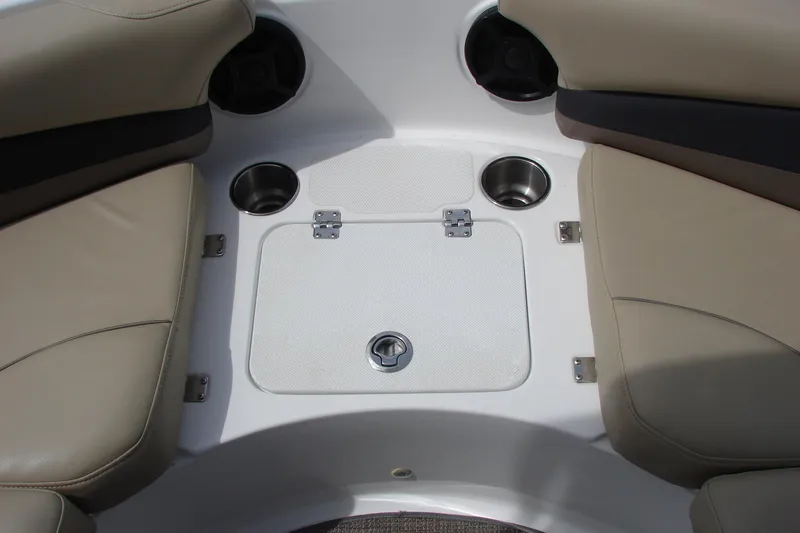 Slide: The Image of Interior seating and storage of 2017 Hurricane SunDeck Sport 202 IO boat, featuring cup holders. - 31