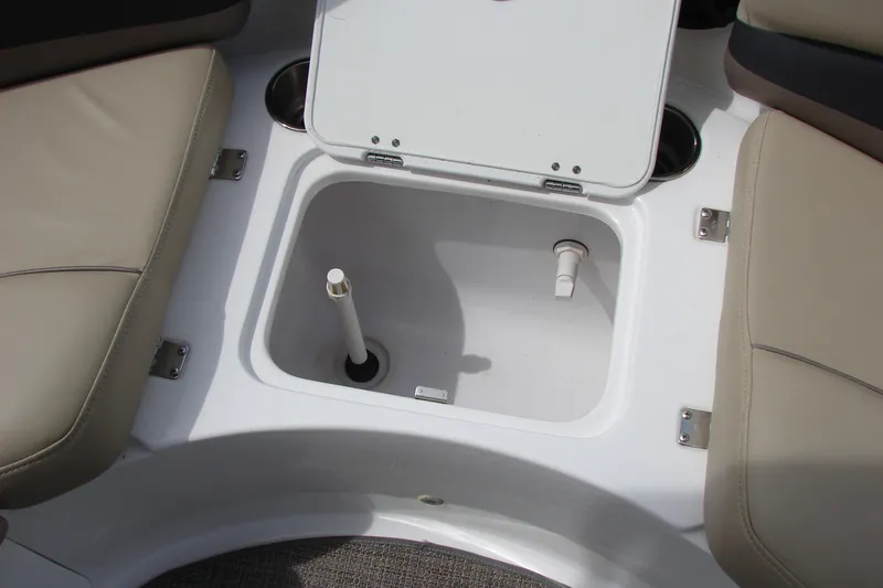 Slide: The Image of Open storage compartment on 2017 Hurricane SunDeck Sport 202 IO boat with beige seating. - 33
