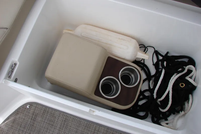 Slide: The Image of Storage compartment in a 2017 Hurricane SunDeck Sport 202 IO with cup holders and ropes. - 35