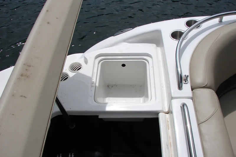 Slide: The Image of 2017 Hurricane SunDeck Sport 202 IO boat interior with seating and storage compartment. - 42