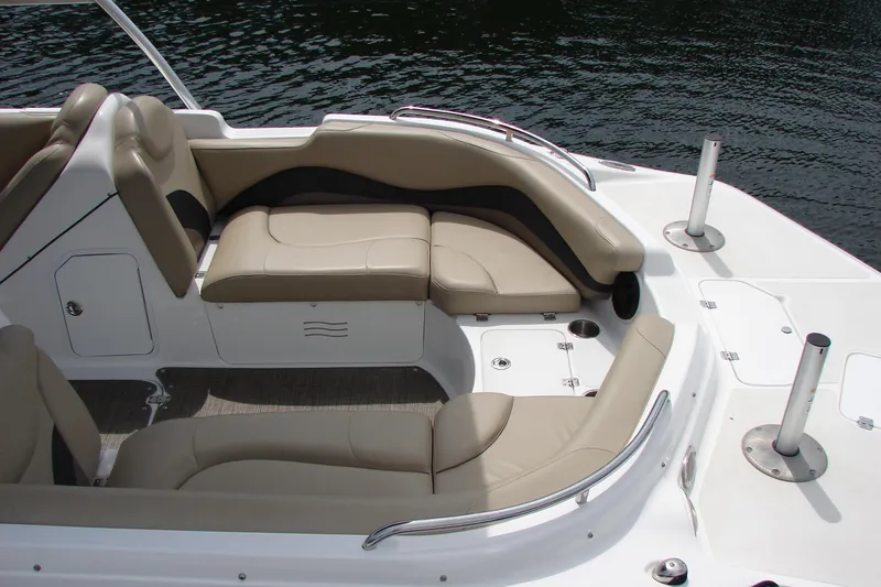 Slide: The Image of 2017 Hurricane SunDeck Sport 202 IO boat interior with beige seating and sleek design. - 7