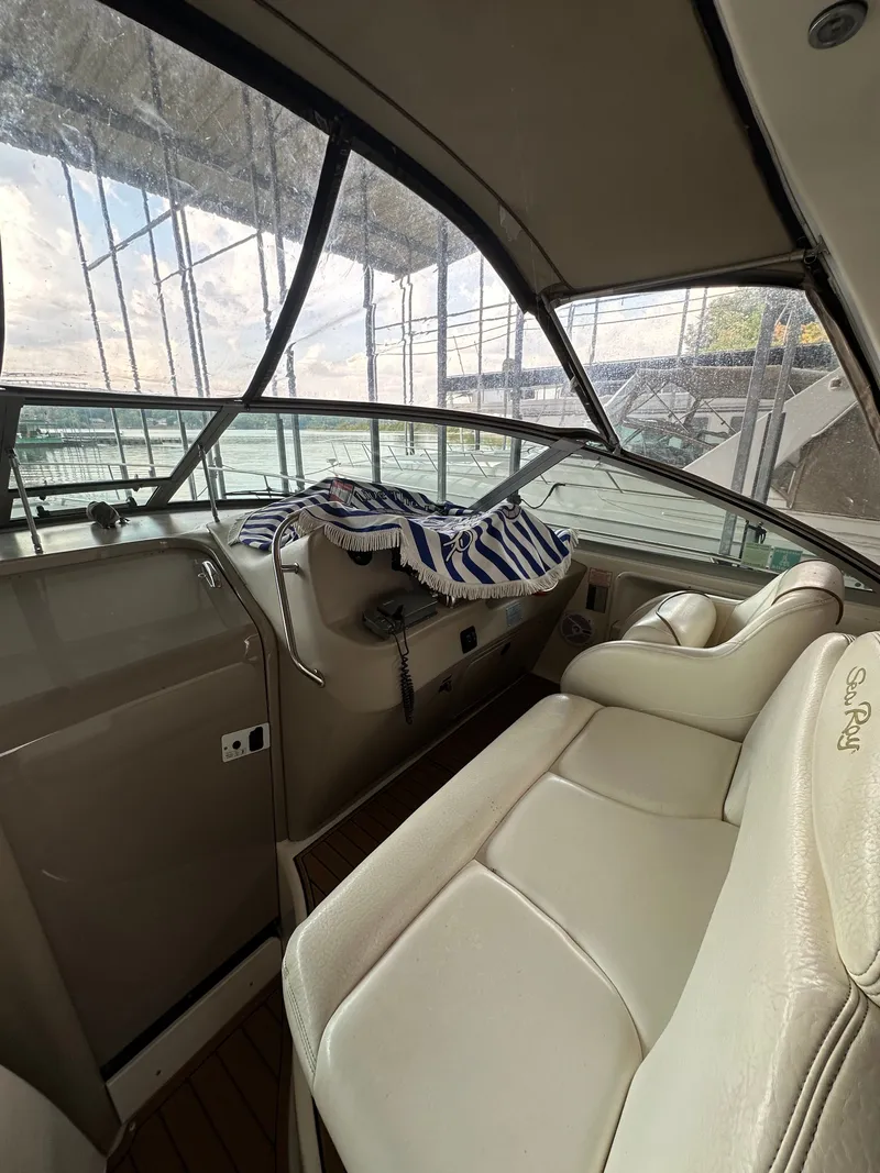 Slide: The Image of Interior of a 1999 Sea Ray 340 Sundancer yacht with leather seating. - 10