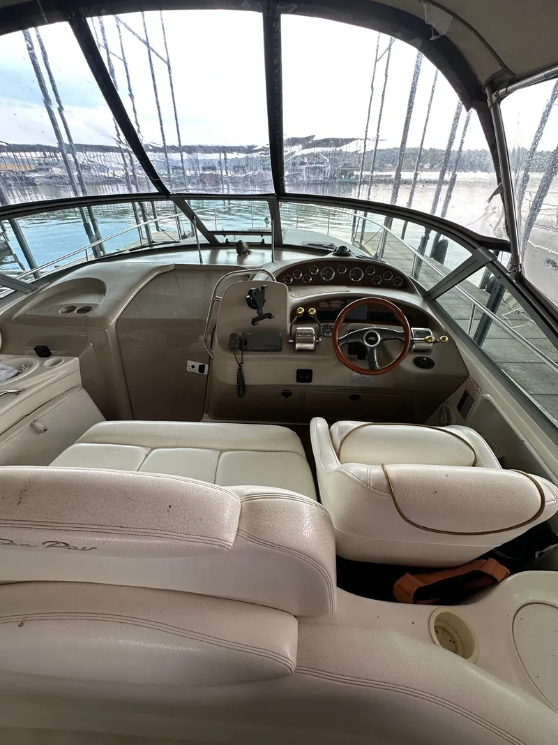 Slide: The Image of Interior of a 1999 Sea Ray 340 Sundancer yacht with helm station. - 12