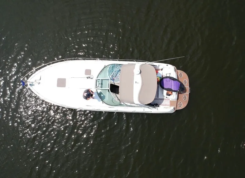 Slide: The Image of Aerial view of a 1999 Sea Ray 340 Sundancer on the water. - 2
