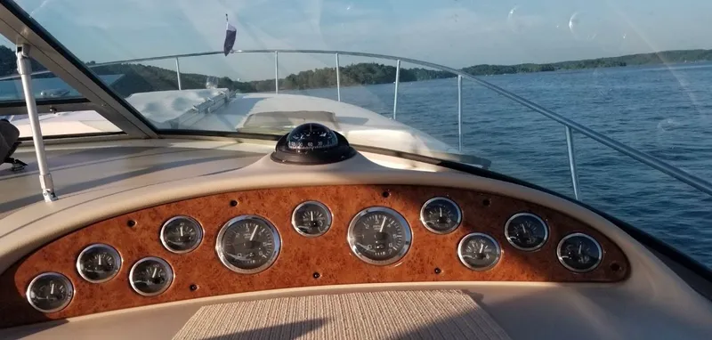 Slide: The Image of Dashboard of 1999 Sea Ray 340 Sundancer on open water. - 21