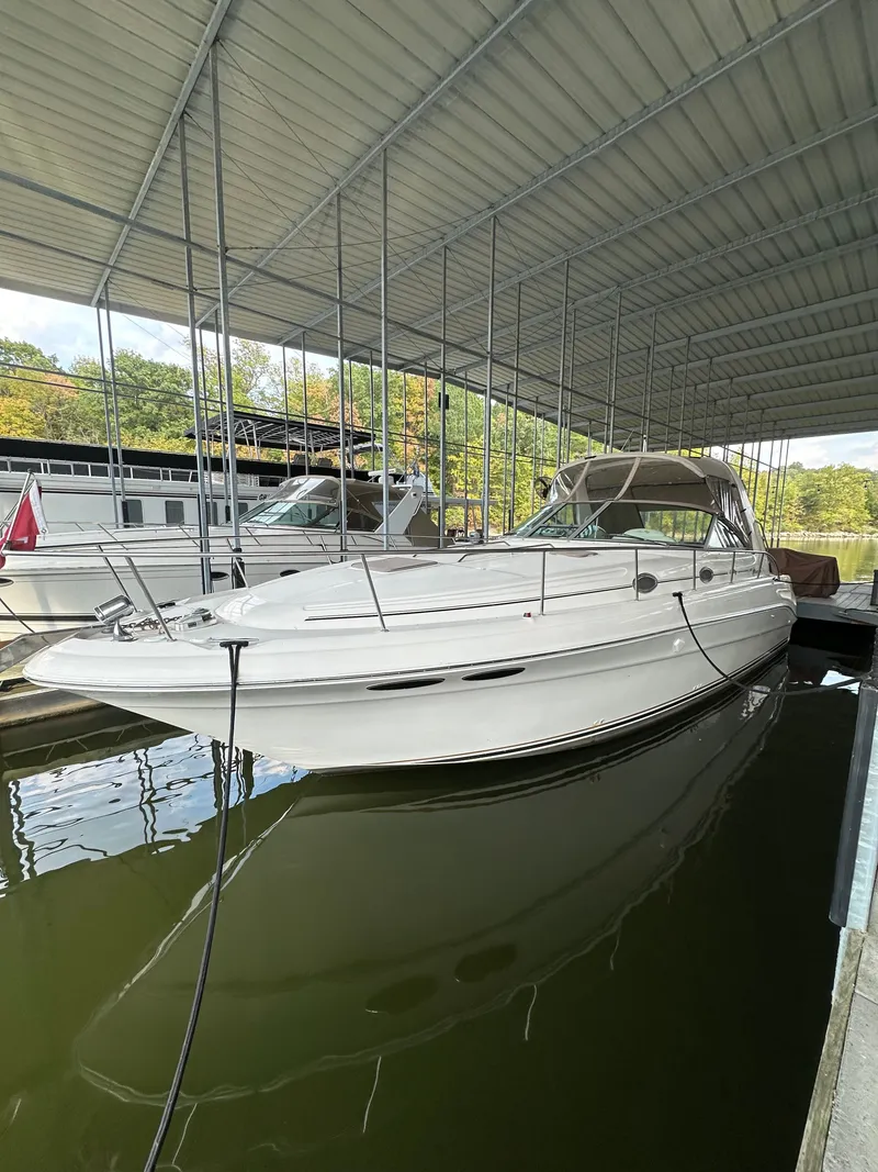 Slide: The Image of 1999 Sea Ray 340 Sundancer docked in marina. - 3