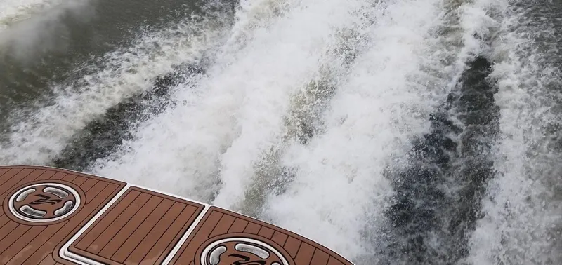 Slide: The Image of Rear view of 1999 Sea Ray 340 Sundancer on water. - 6