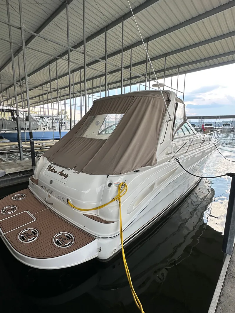 Slide: The Image of 1999 Sea Ray 340 Sundancer in a covered boat slip. - 7