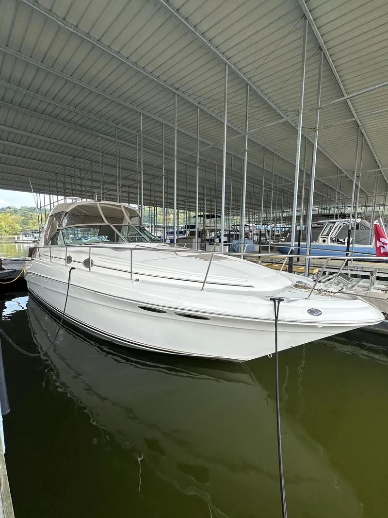 Slide: The Image of 1999 Sea Ray 340 Sundancer in covered marina. - 8
