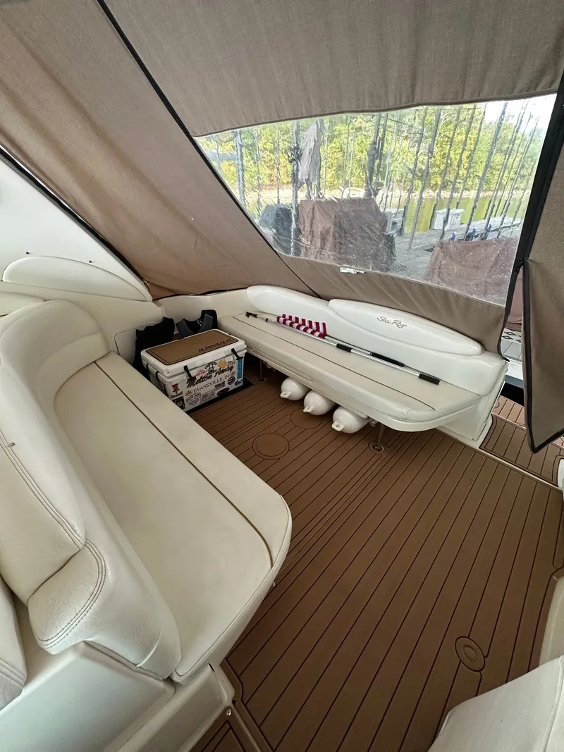 Slide: The Image of Interior of a 1999 Sea Ray 340 Sundancer yacht with seating area. - 9